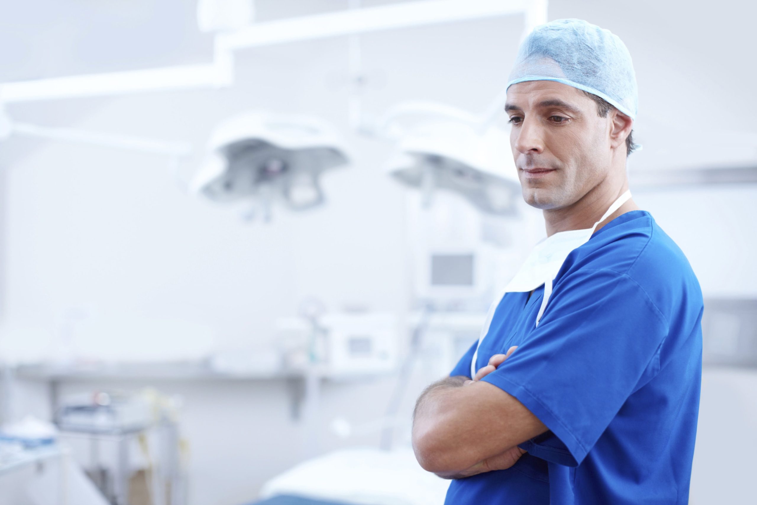 Jail time increased for attacks on medical staff. Image shows Doctor in blue outfit. Public health spending in Italy lowest in G7