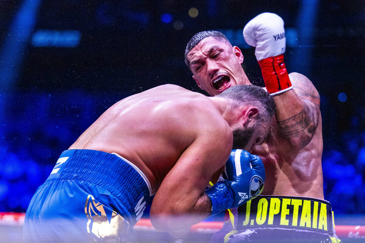 Noel Mikaelian takes a punch from Jai Opetaia during their Zuffa & Ring Cruiserweight World ...