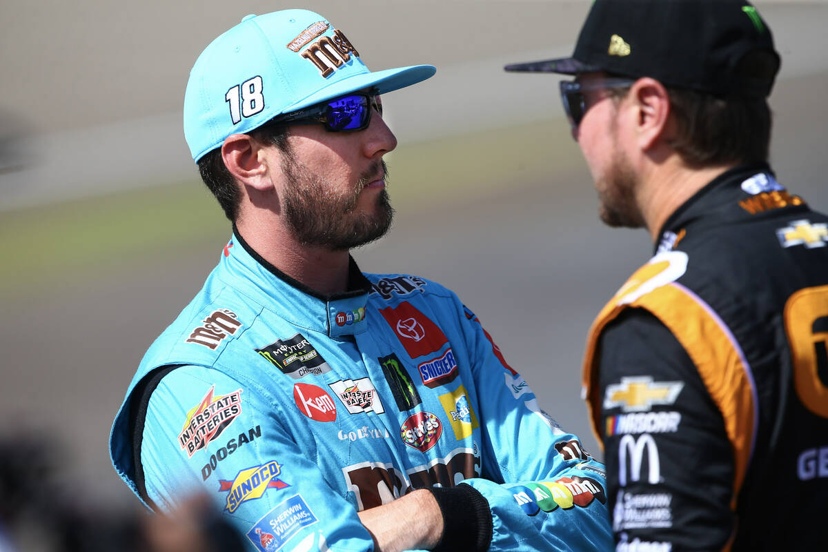 Kyle Busch, left, talks with Kurt Busch before qualifying for the Monster Energy NASCAR Cup Ser ...