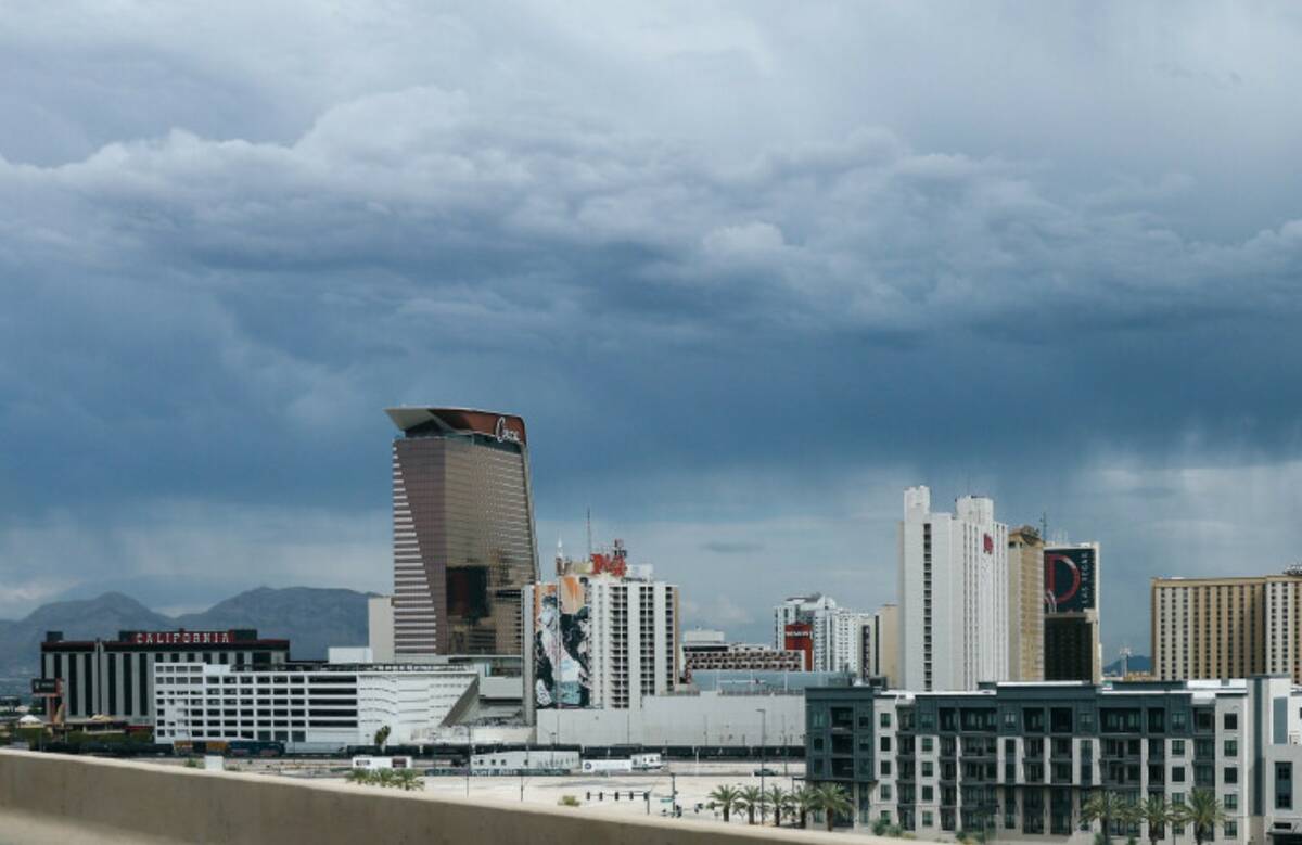 Storm clouds gather over the skyline on Thursday, Aug. 13, 2026, near downtown Las Vegas. (Liv ...