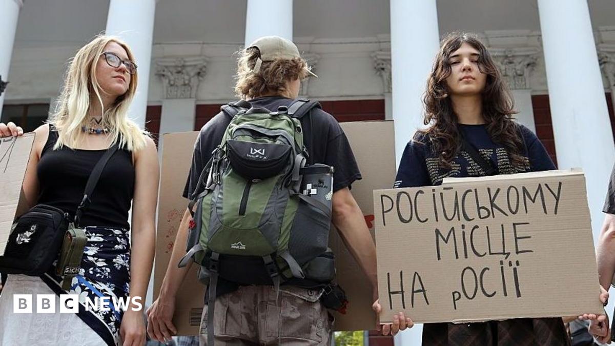 Activists holding placards take part in a rally in support of introducing a moratorium on the public use of Russian-language cultural products on July 8, 2026 in Odesa, Ukraine