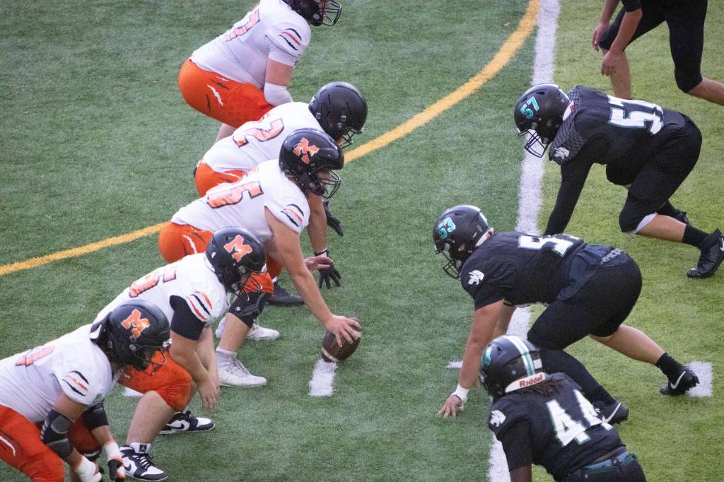 The Monroe football offense lines up across from Jackson on Friday, Sep. 4, 2026 at Everett Memorial Stadium in Everett. (Qasim Ali / The Herald)