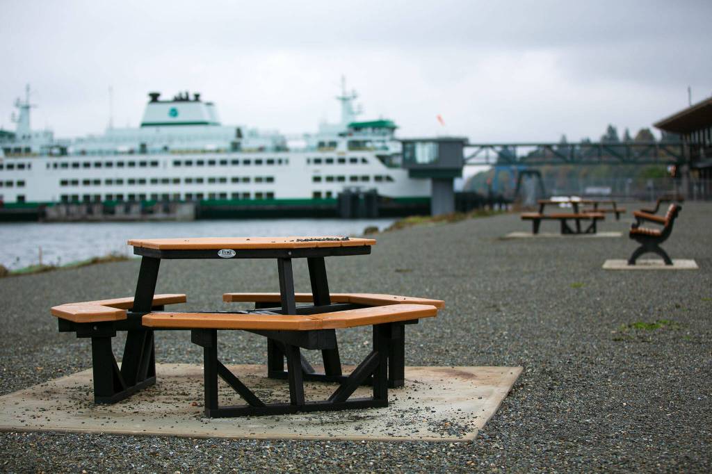 New benches and tables line the waterfront at a new park near the Mukilteo ferry terminal in October 2023 in Mukilteo. (Ryan Berry / The Herald)
