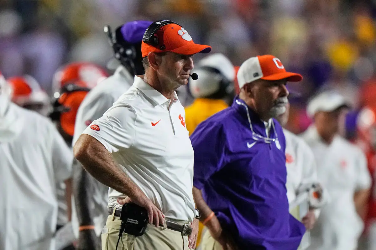 Clemson head coach Dabo Swinney reacts after an LSU touchdown in the second half of an NCAA col ...