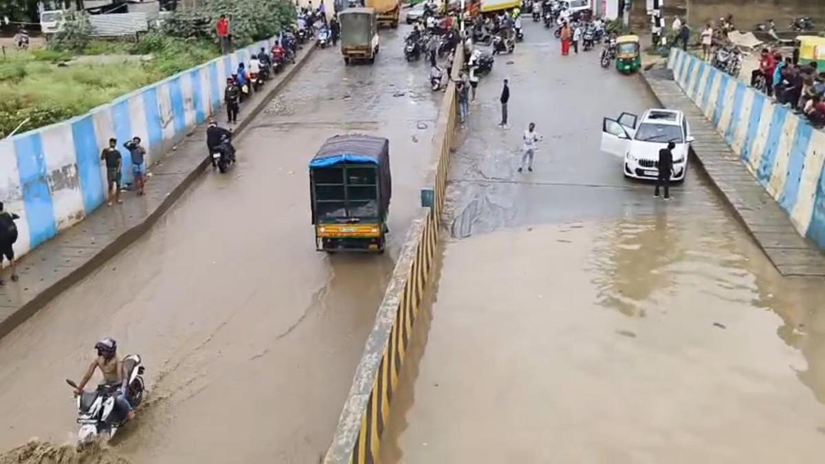 Panathur Railway Underbridge submerged after rain, commuters struggle through hip-deep water