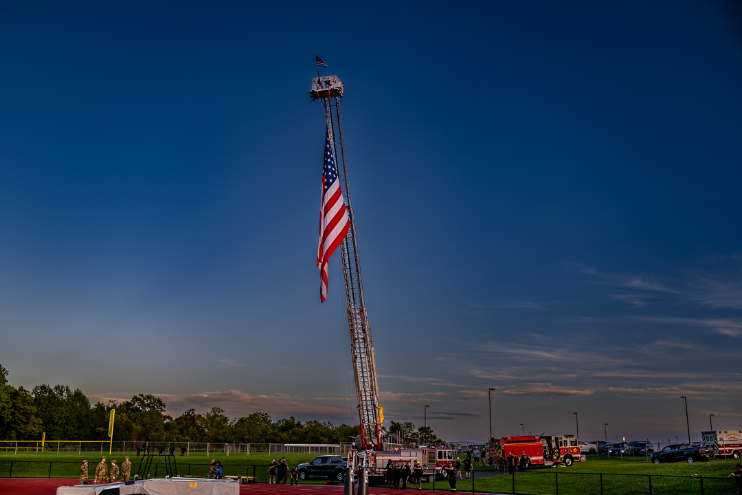 The Odessa Fire Company displays a large American flag from one of its engines as Odessa celebrated Military Appreciation Night.