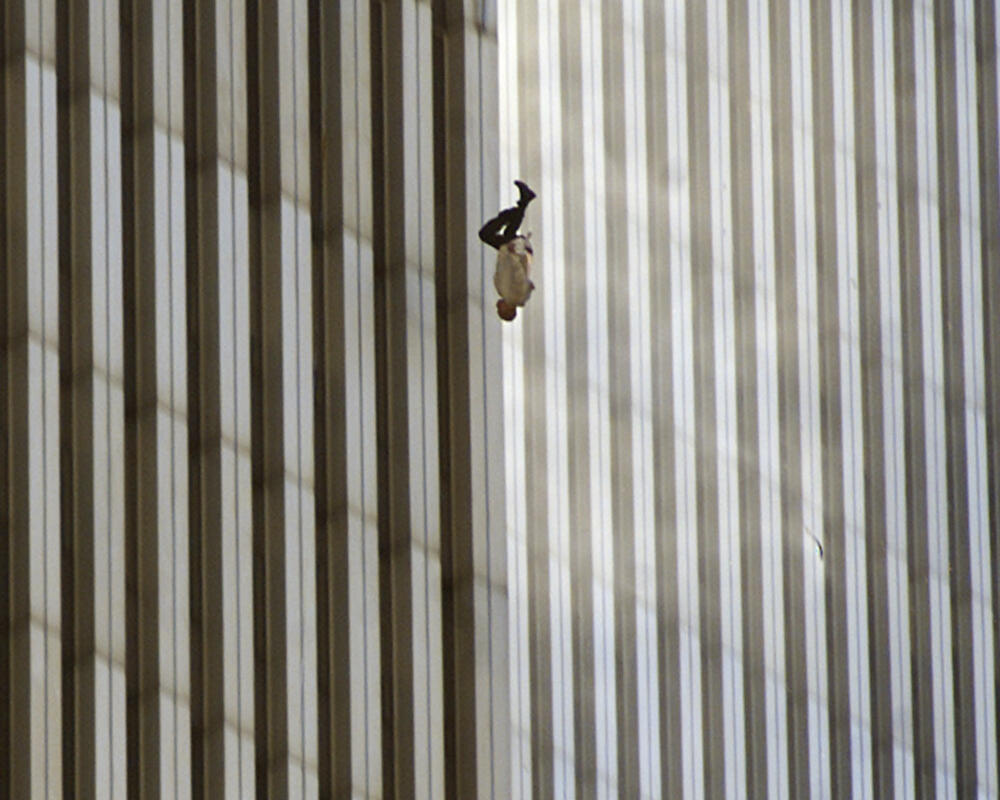 A person falls from the north tower of New York's World Trade Center Tuesday Sept. 11, 2001, after terrorists crashed two hijacked airliners into the World Trade Center and brought down the twin 110-story towers. (Richard Drew/AP)