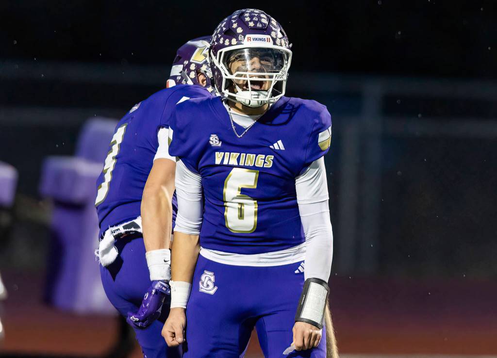Lake Stevens’ Blake Moser yells after scoring a touchdown during the 4A state football quarterfinal game against Moses Lake on Nov. 22, 2025 in Lake Stevens, Washington. (Olivia Vanni / The Herald)