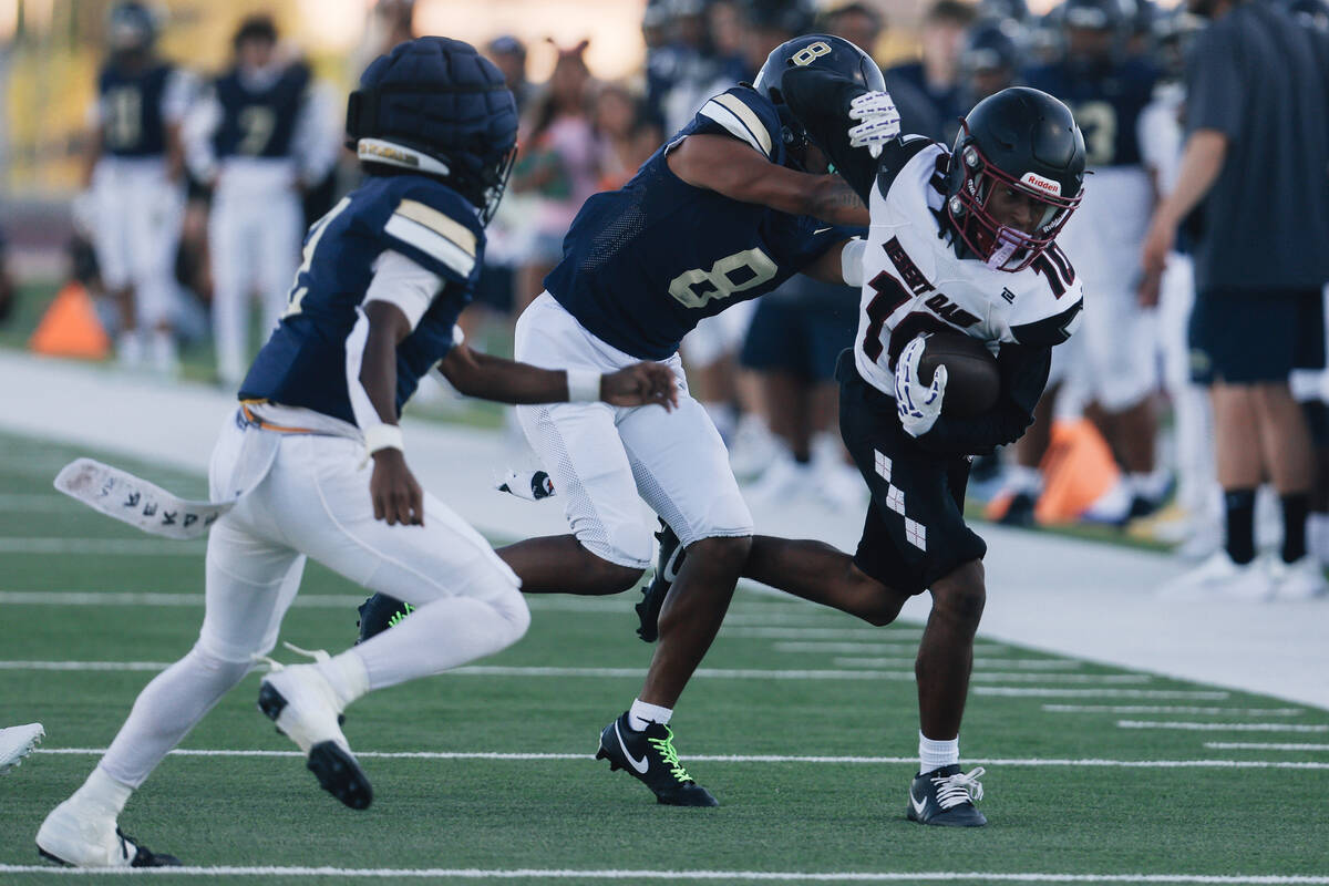 Desert Oasis wide receiver Jeremiah King (10) runs the ball during a high school football game ...