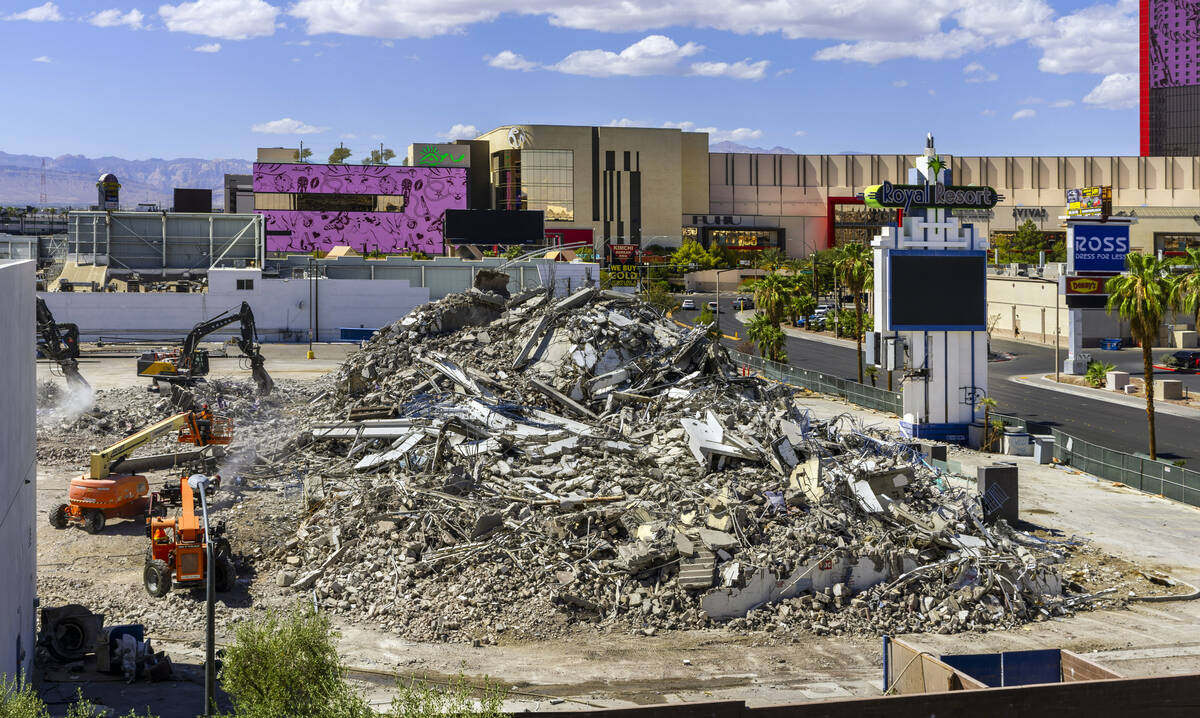 A crew works to clear away the rubble that was once the Royal Resort on Wednesday, September 16 ...