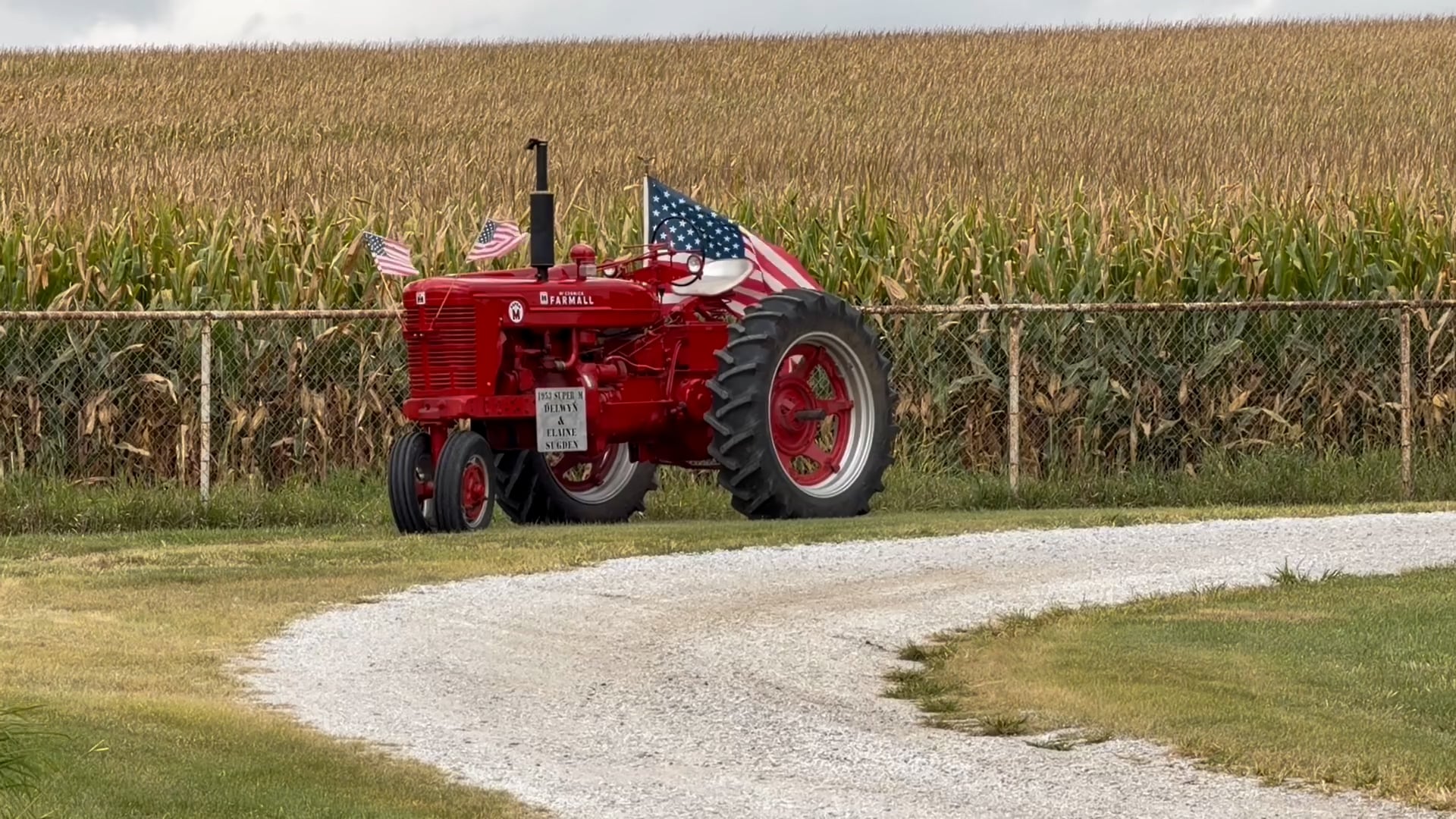 Rural America Remembers; Highway 77 lined with farm equipment and American flags