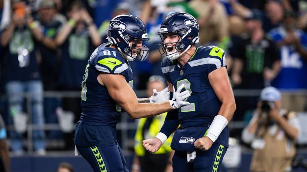 Seahawks quarterback Drew Lock (2) celebrates with tight end Eric Saubert (81) after throwing a game-tying touchdown in a win over the New England Patriots on Wednesday, Sept. 9, 2026 at Lumen Field in Seattle, Washington. (Photo courtesy of Rod Mar / Seattle Seahawks)