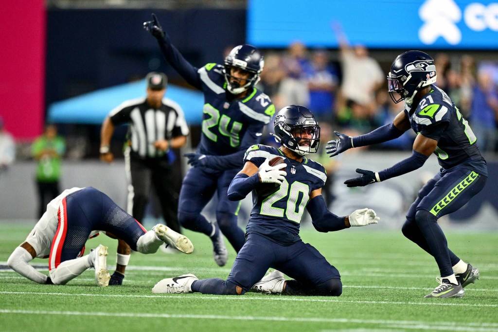Julian Love (20) of the Seattle Seahawks celebrates after an interception against the New England Patriots during the fourth quarter in the game at Lumen Field on Sept. 9, 2026 in Seattle, Washington. (Jane Gershovich / Getty Images / The Athletic)