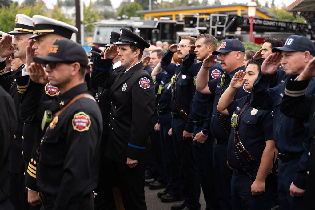 Firefighters salute on Friday, Sept. 11, 2026, during a ceremony at the Fallen Firefighter Memorial Park in Edmonds, Washington, commemorating the 25th anniversary of the Sept. 11, 2001 attacks. (Will Geschke / The Herald)
