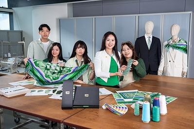 A team of teachers and students from the Bachelor of Arts (Honours) in Fashion Design programme at THEi creates the “Hong Kong’s First Five-Year Plan” team badge, designing ties and scarves for CE and his team in “Policy Address” for second year.      Design team members from the left: Mr Michael CHAN Tsz-him; Ms Rainbow LEE Chui-shan; Ms Janet CHAN Mei-hang; and Ms Karen CHEUNG Kit-man. Second right: Ms Jenny CHEUNG Ling, Assistant Professor of the Department of Design and Architecture at THEi.