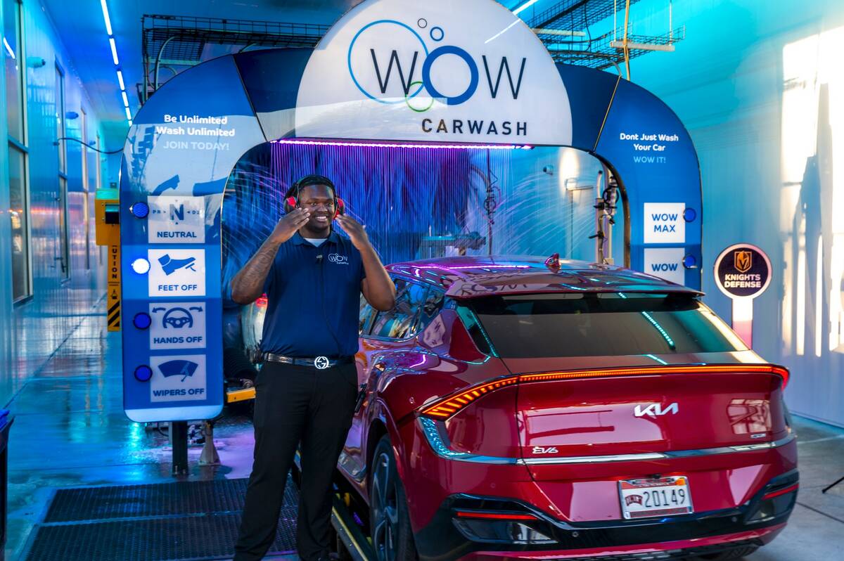 Attendant Rodney Leaks guides in another customer's car to be cleaned in the Wow Carwash at 858 ...