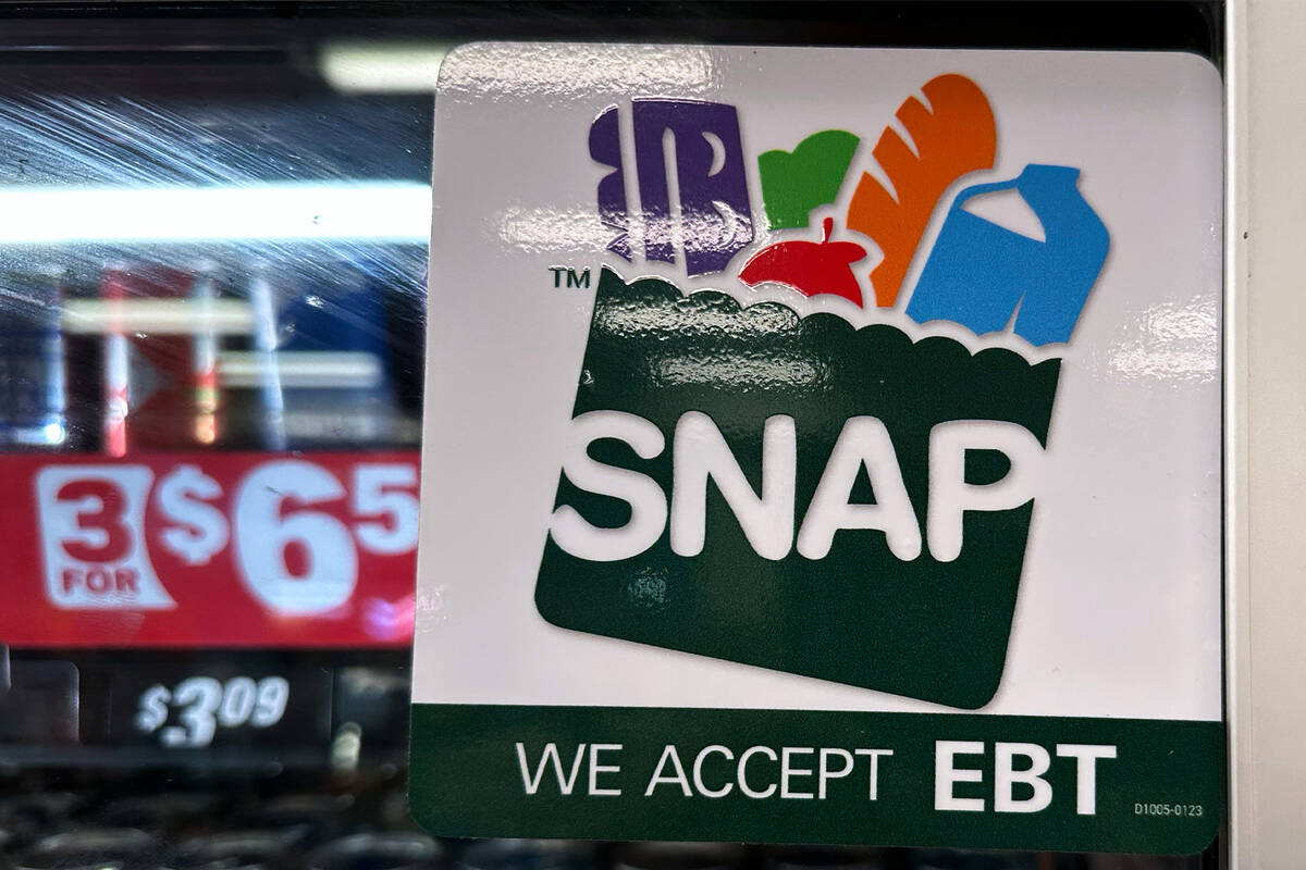 SNAP EBT information sign is displayed at a gas station in Riverwoods, Ill., Saturday, Nov. 1, ...
