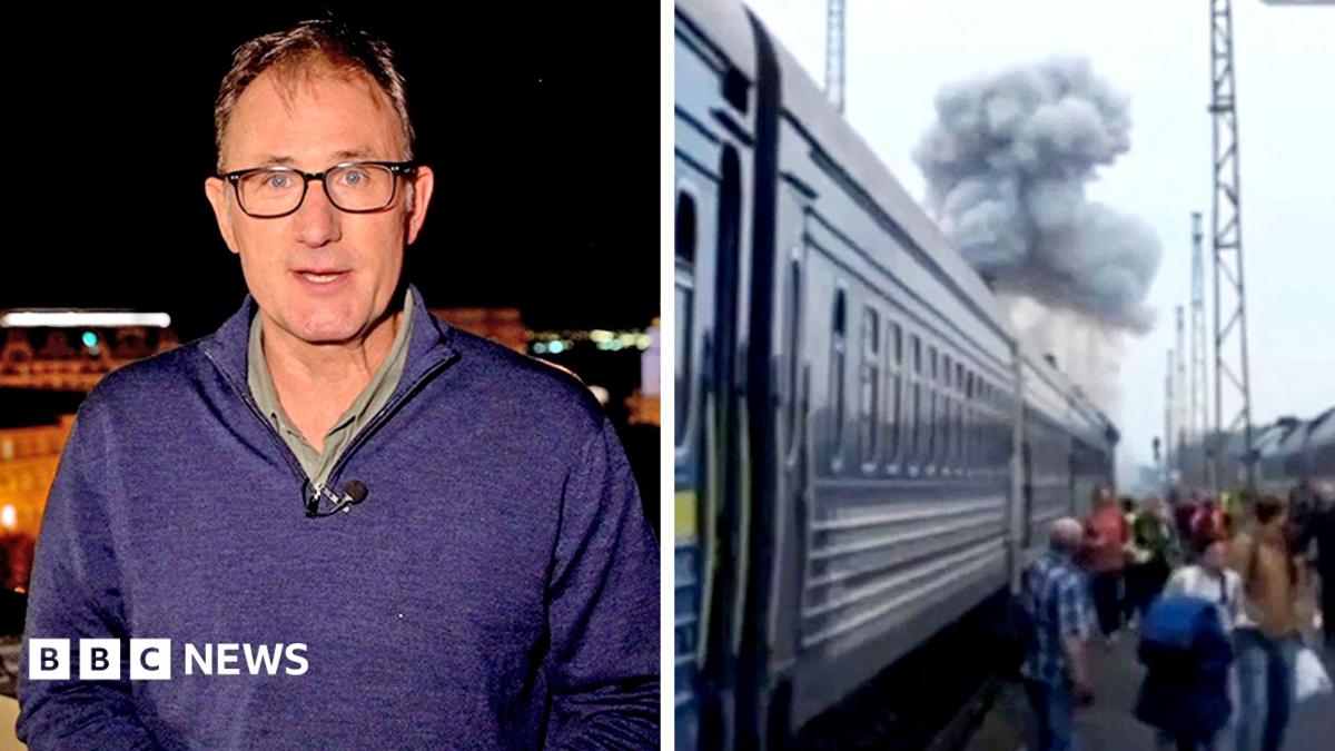 Split screen showing BBC reporter talking to camera at night and a train with smoke from an explosion above it.