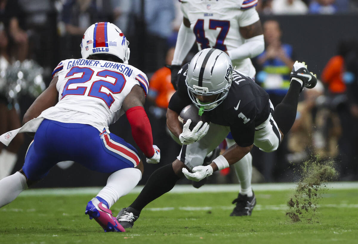 Raiders wide receiver Tre Tucker (1) runs the ball as Buffalo Bills safety C.J. Gardner-Johnson ...