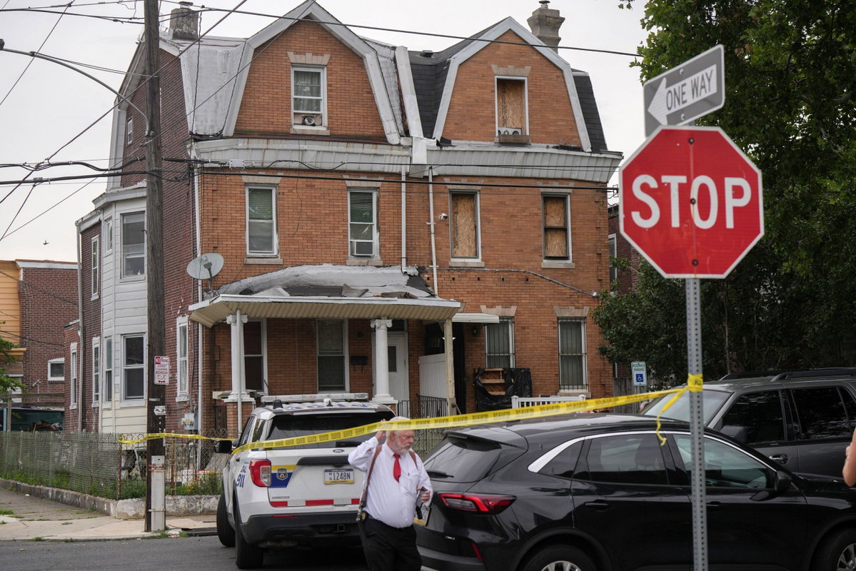 Kyle Mazza/Sipa/AP via CNN NewsourceA law enforcement officer carries evidence bags