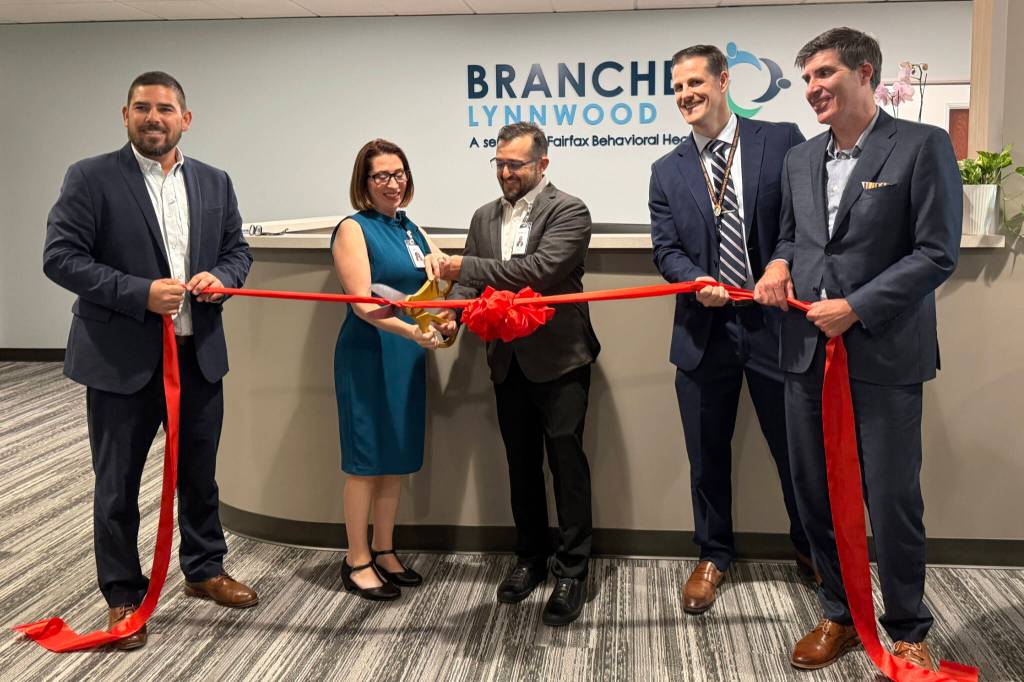 Fairfax Behavioral Health officials cut the ribbon at the Branches Lynnwood opening ceremony on Friday, Oct. 2, 2026, in Lynnwood, Washington. (Jenna Peterson / The Herald)