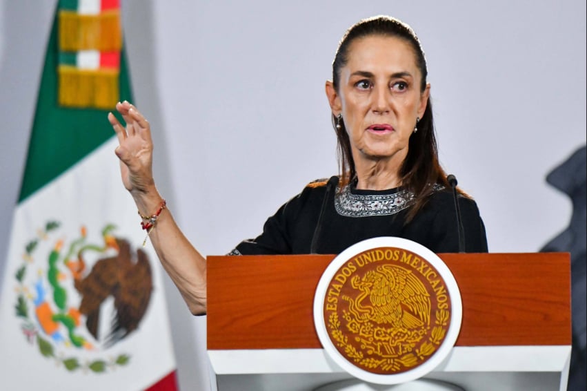 President Sheinbaum gestures behind the podium of her Wednesday October 21 press conference.