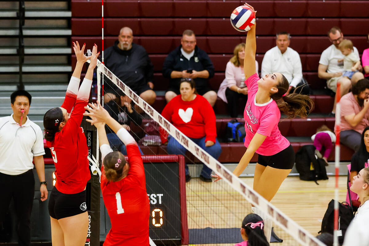 Faith Lutheran Crusaders junior Chloe Garcia (11) hits the ball during a Class 5A girls volleyb ...
