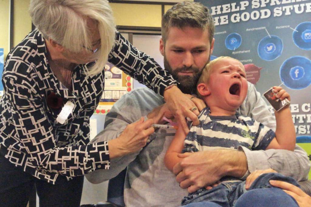 A youngster cries while getting his flu shot. Bartlett Regional Hospital treated influenza patients earlier than usual this fall as health providers prepared for the winter respiratory illness season. (Black Press Media file photo)
