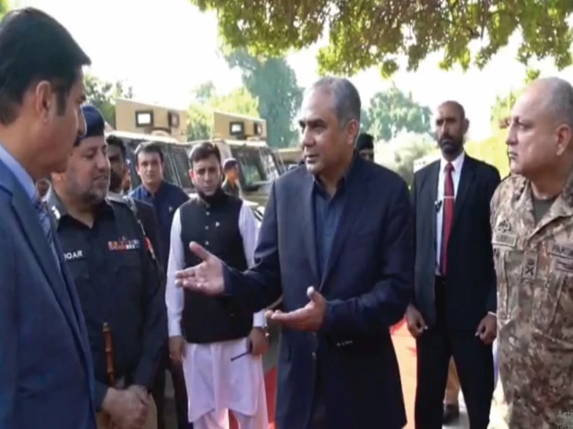 interior minister mohsin naqvi speaks with k p governor faisal karim kundi at a ceremony to hand over armoured vehicles to the k p police at the governor house photo express screengrab