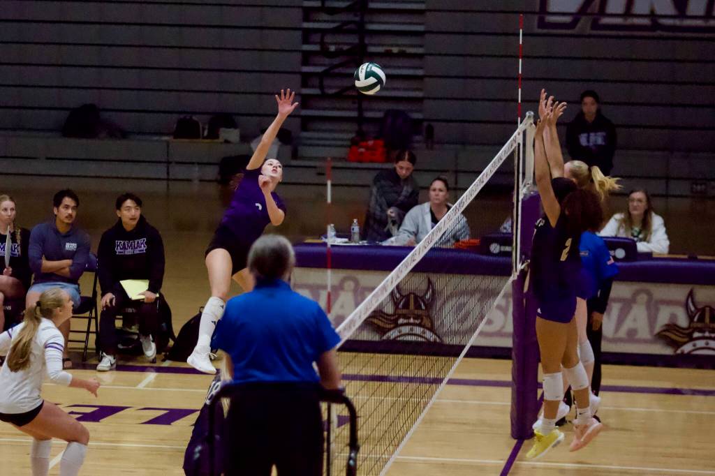 Kamiak senior Cadence Bigby spikes the ball over the net during the Knights’ 3-2 win against the Vikings at Lake Stevens High School on Oct. 15, 2026. (Joe Pohoryles / The Herald)