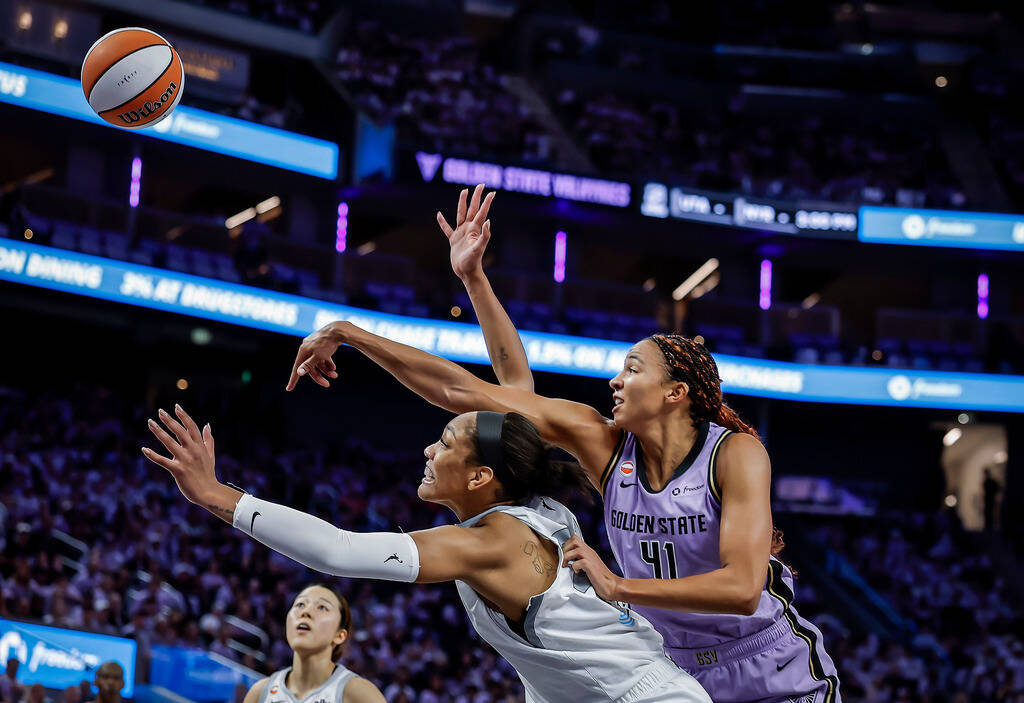 Golden State Valkyries' Kiah Stokes (41) battles for a rebound against Las Vegas Aces' ...