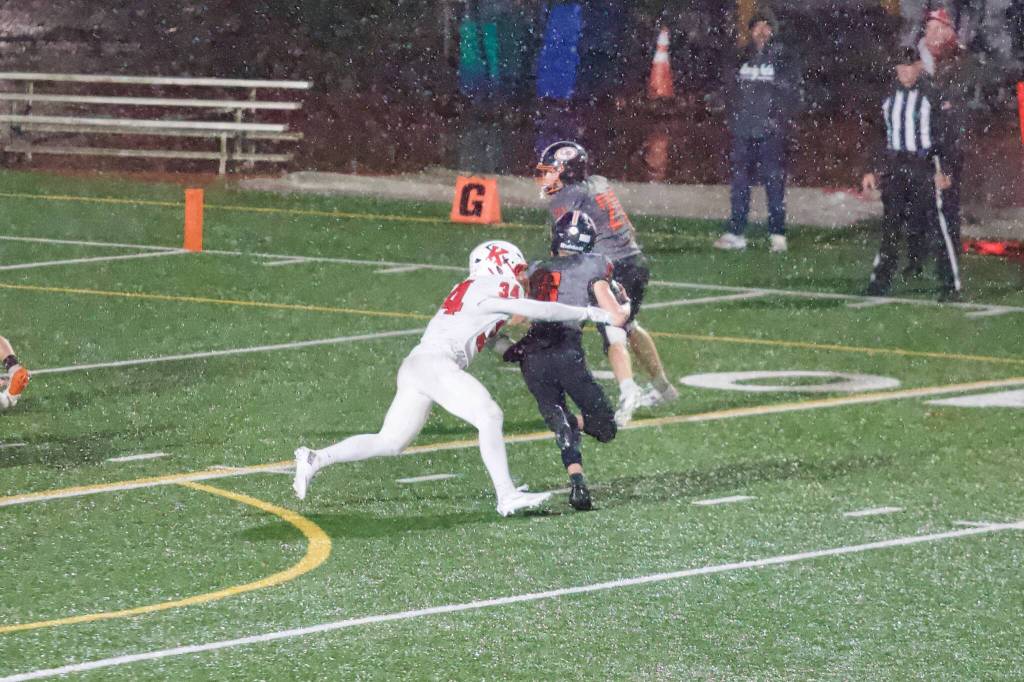 King’s junior Jack Kappus attempts to bring down Granite Falls senior Jaxx Goldsmith during the Knights’ 24-22 win against the Tigers at Woolsey Stadium on Oct. 30, 2026. (Joe Pohoryles / The Herald)