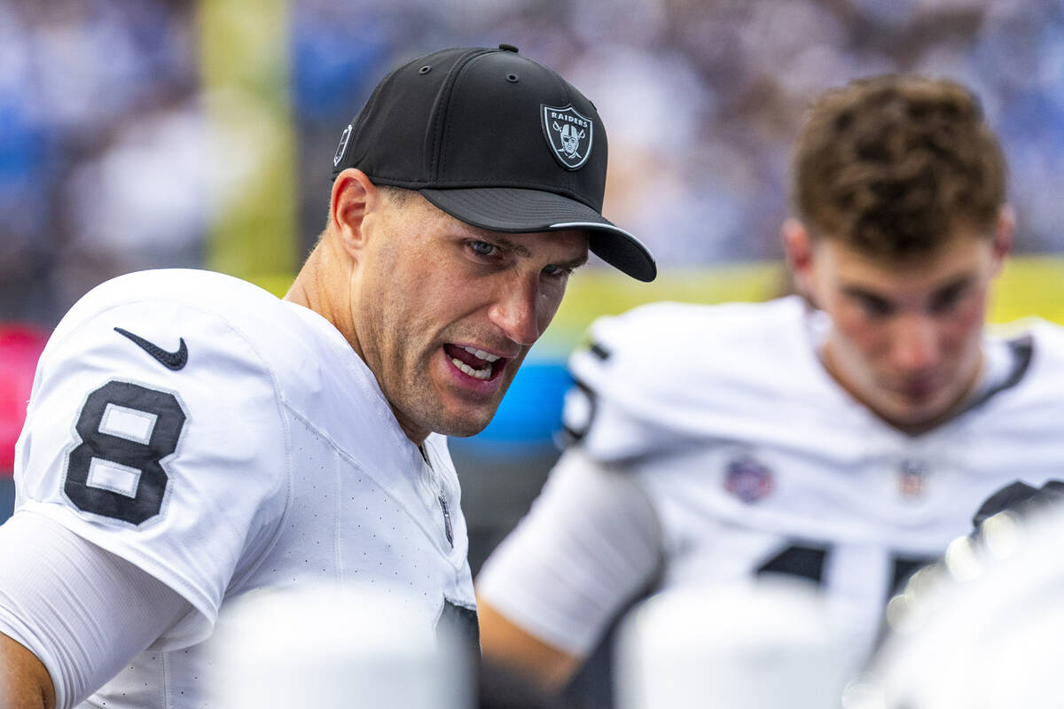 Raiders quarterback Kirk Cousins (8) talks with teammates on the sidelines against Los Angeles ...