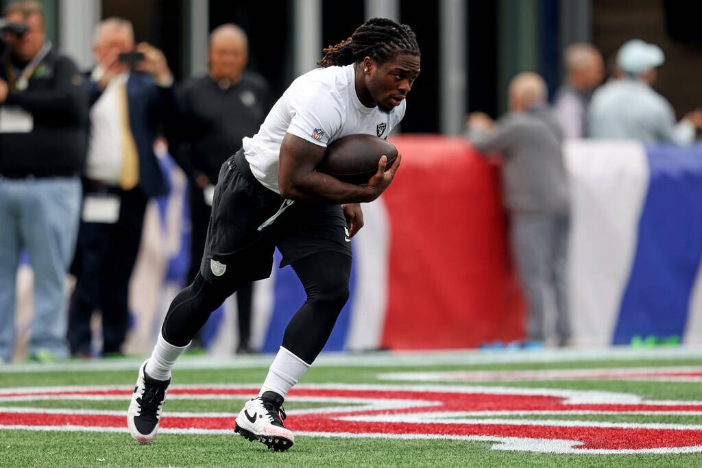 Raiders running back Ashton Jeanty (2) goes through drills before an NFL football game against ...