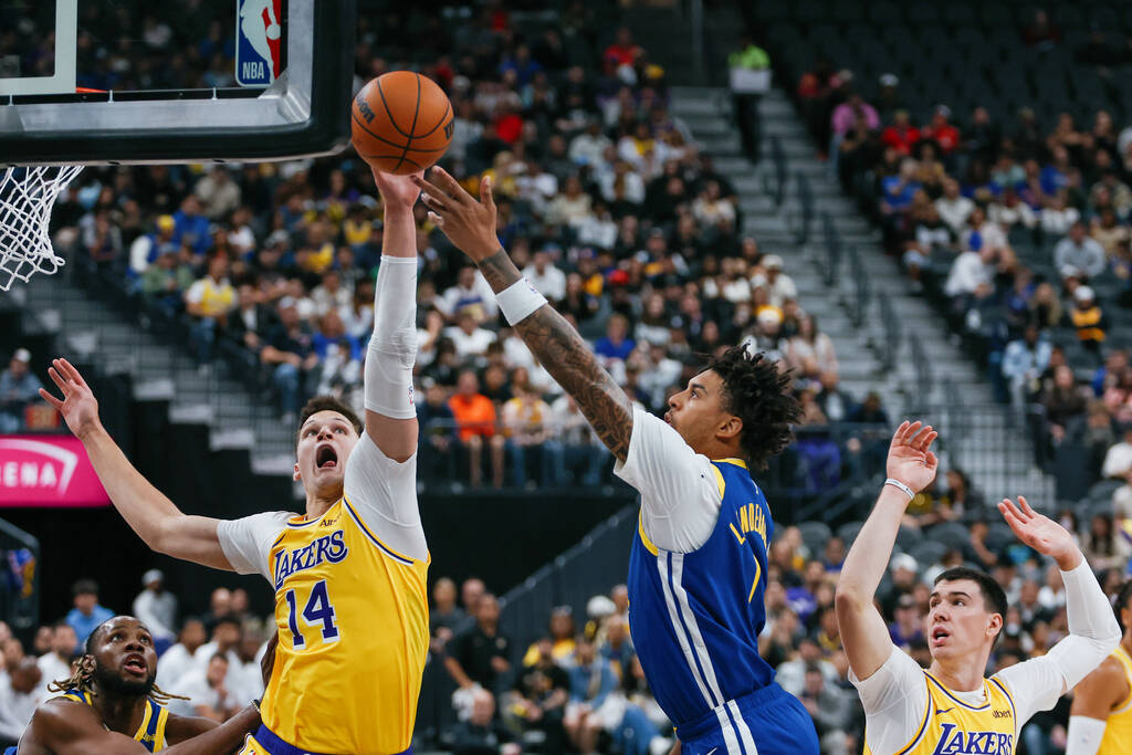 Golden State Warriors forward Yaxel Lendeborg (1) attempts a shot over Los Angeles Lakers cente ...