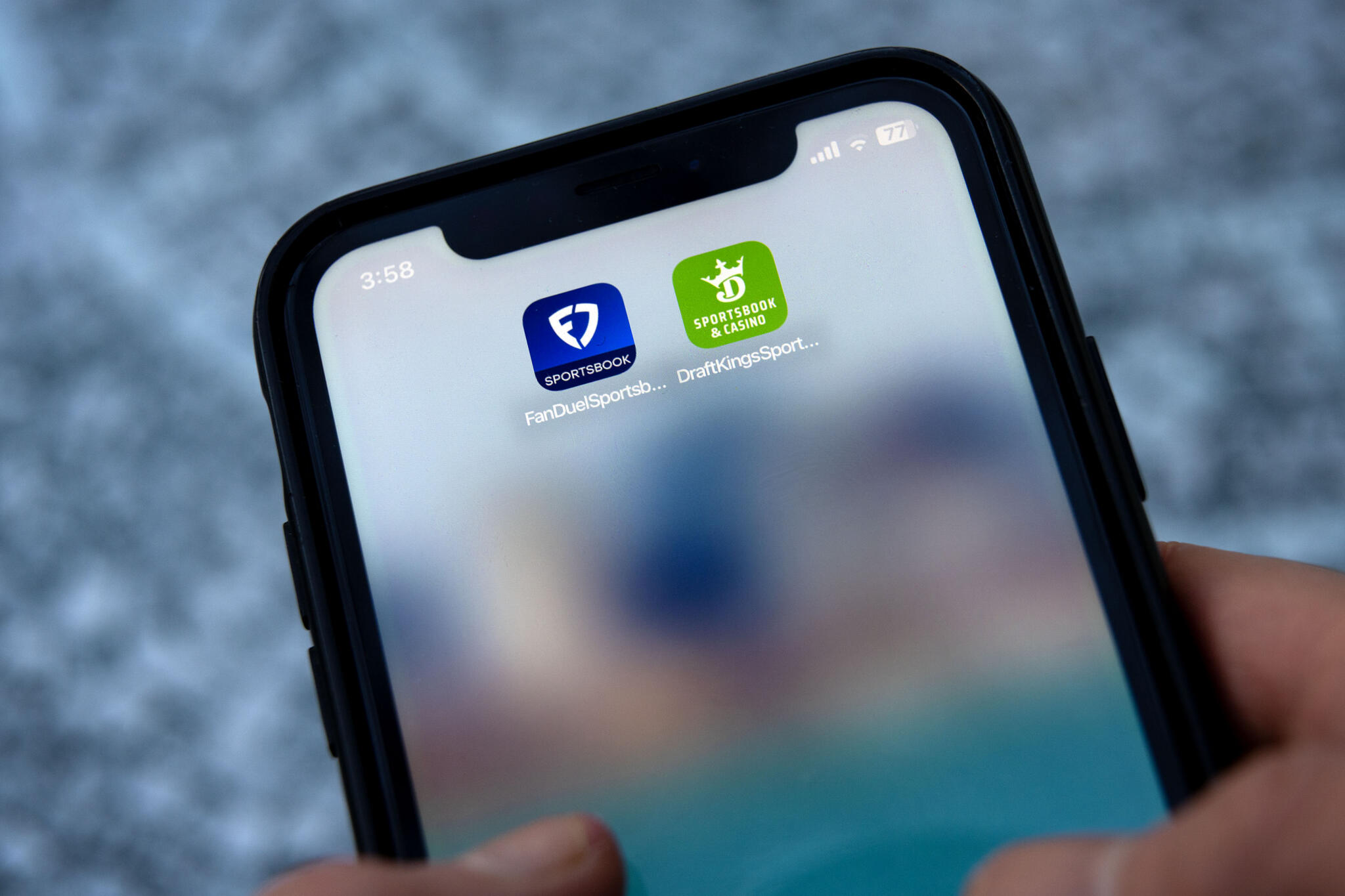 The FanDuel and DraftKings apps on a mobile phone. (Robin Lubbock/WBUR)