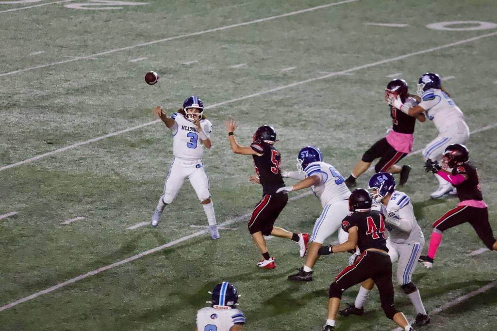 Meadowdale senior Zekiah Gamble releases a pass during the Mavericks’ 21-20 overtime win against Mountlake Terrace at Edmonds Stadium on Oct. 16, 2026. (Joe Pohoryles / The Herald)
