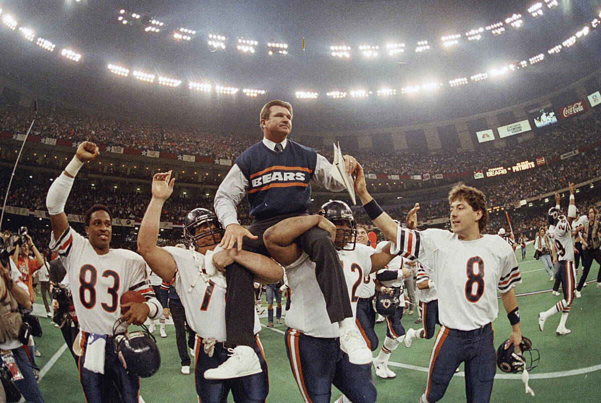 FILE - In this Jan. 26, 1986, file photo, Chicago Bears coach Mike Ditka is carried off the fie ...