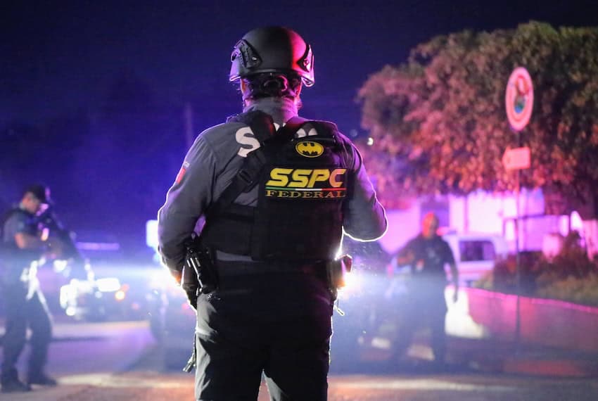 police officer looking out at a crime scene in Morelos