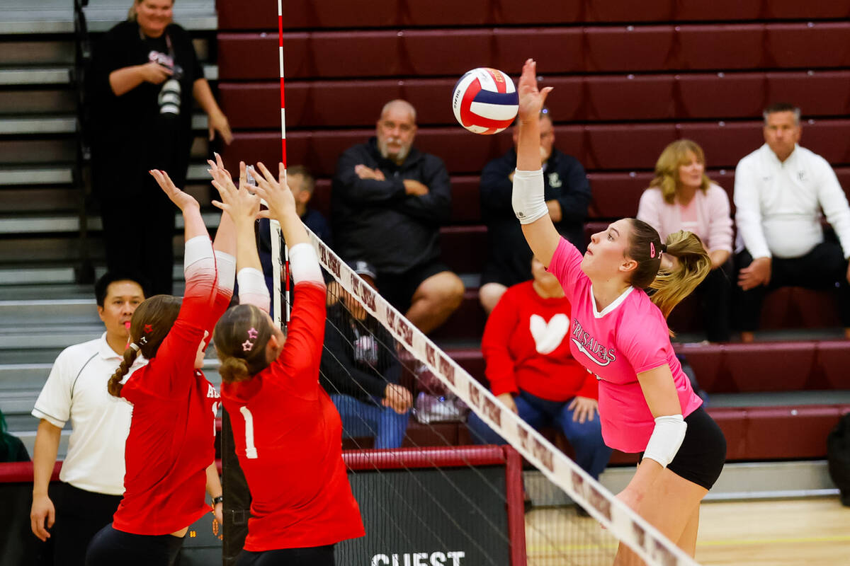 Faith Lutheran Crusaders senior Tori Castro (14) hits the ball during a Class 5A girls volleyba ...