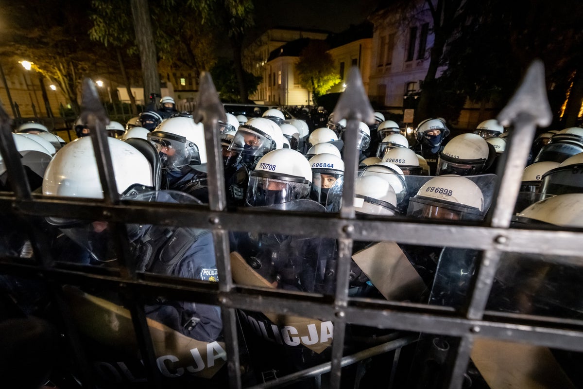 Protests in Poland as president returns to country after Tusk accused of coup against court