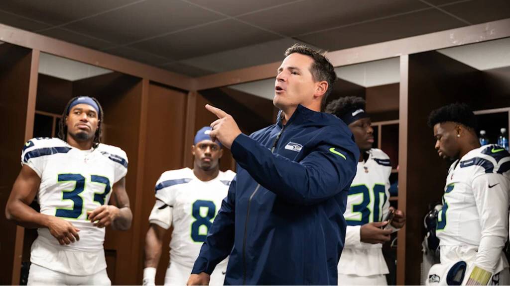 Seahawks head coach Mike Macdonald speaks to his team in the visiting locker room at Northwest Stadium in Landover, Maryland on Sunday, Sept. 17, 2026. (Photo courtesy of Rod Mar / Seattle Seahawks)