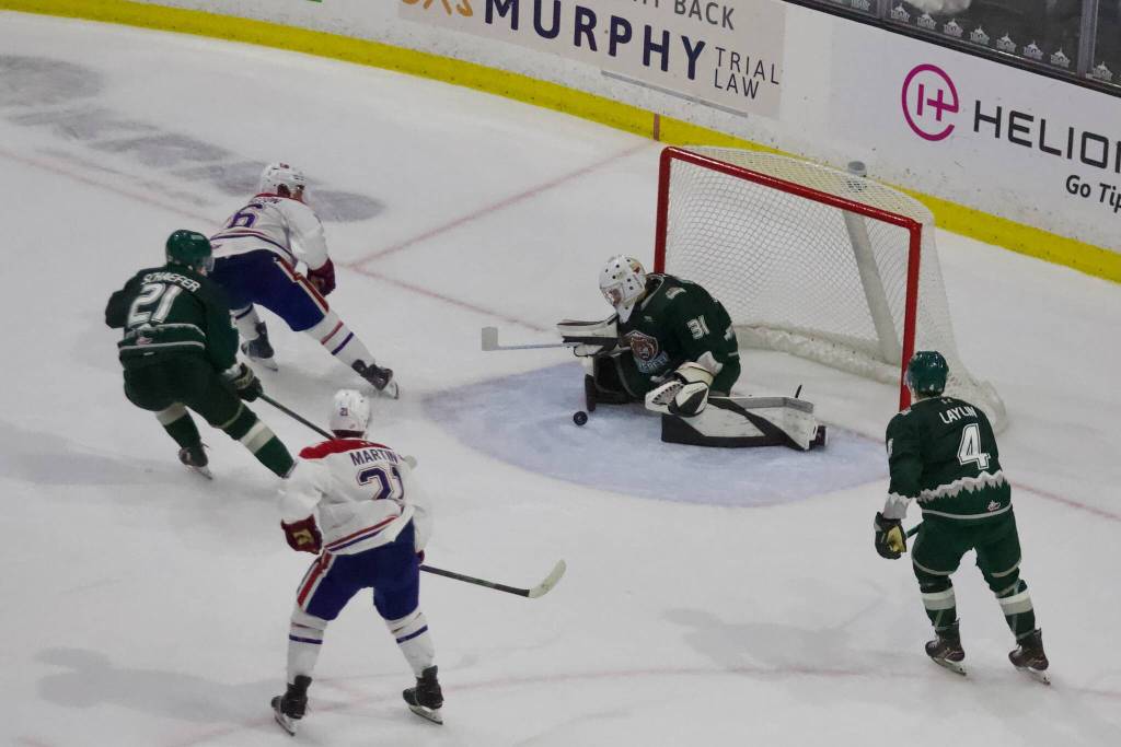 Silvertips goaltender Bennett Byers crouches to stop a shot from Spokane captain Chase Harrington (26) during Everett’s 3-1 loss to Spokane at Angel of the Winds Arena on Oct. 4, 2026. (Joe Pohoryles / The Herald)