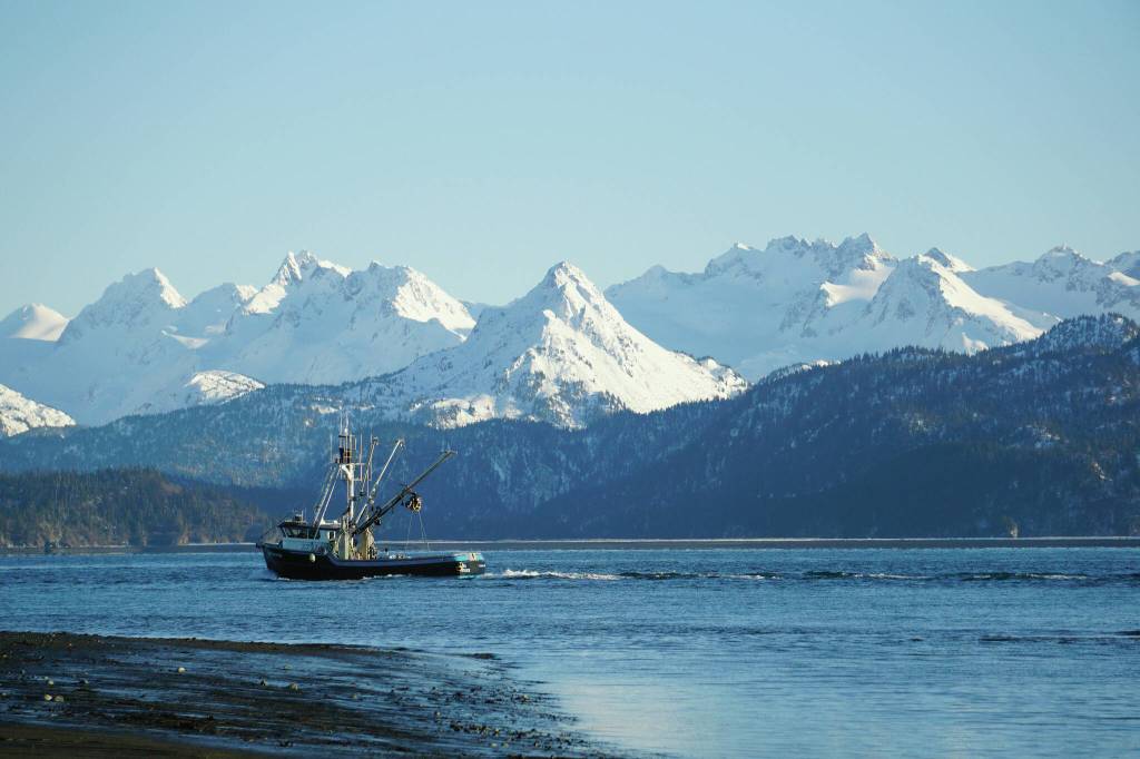 A fishing boat passes in front of Poot Peak near Homer, Alaska. Electronic logbooks will help fishermen share observations with researchers while at sea. (Michael Armstrong/Homer News file photo)