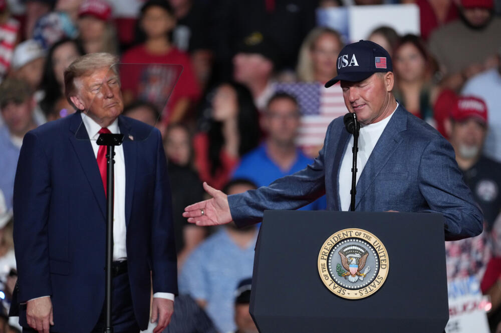President Trump listens as Roger Clemens speaks at a campaign rally in San Antonio, Wednesday, Oct. 7, 2026. (Eric Gay/AP)