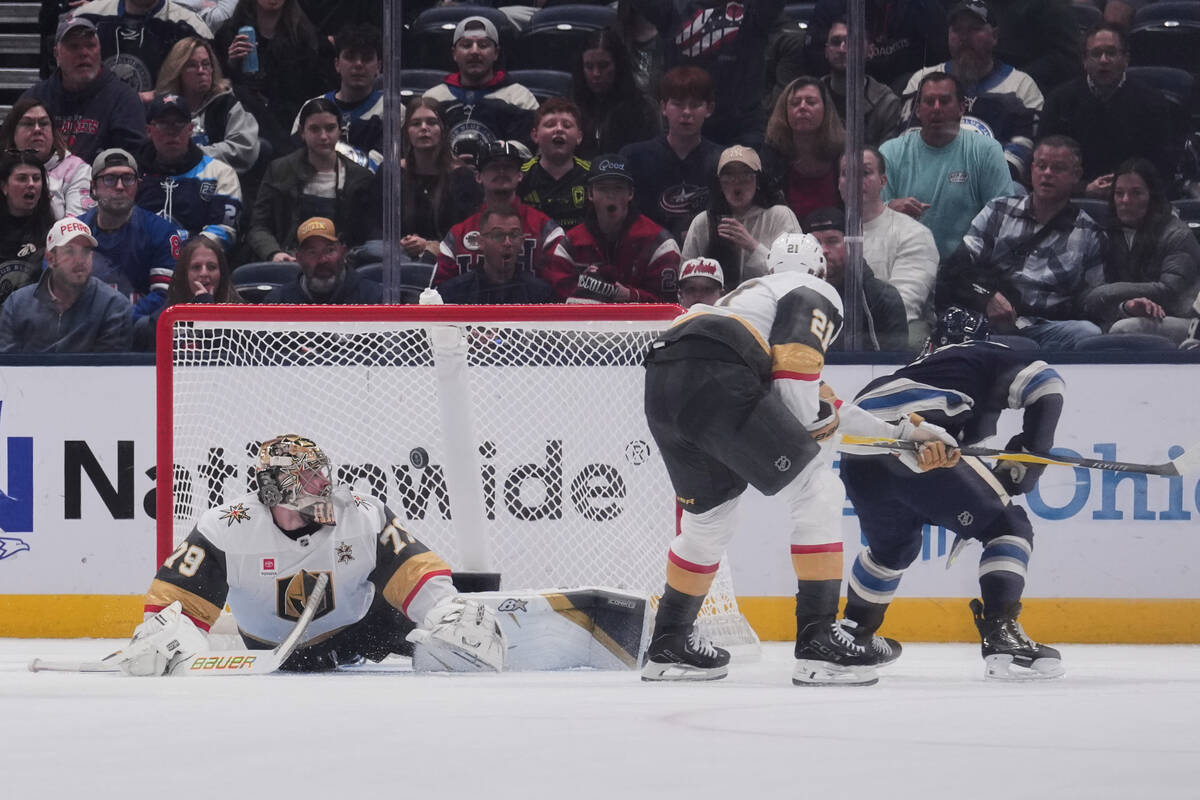 Vegas Golden Knights goaltender Carter Hart (79) watches as the puck enters the goal on a shot ...