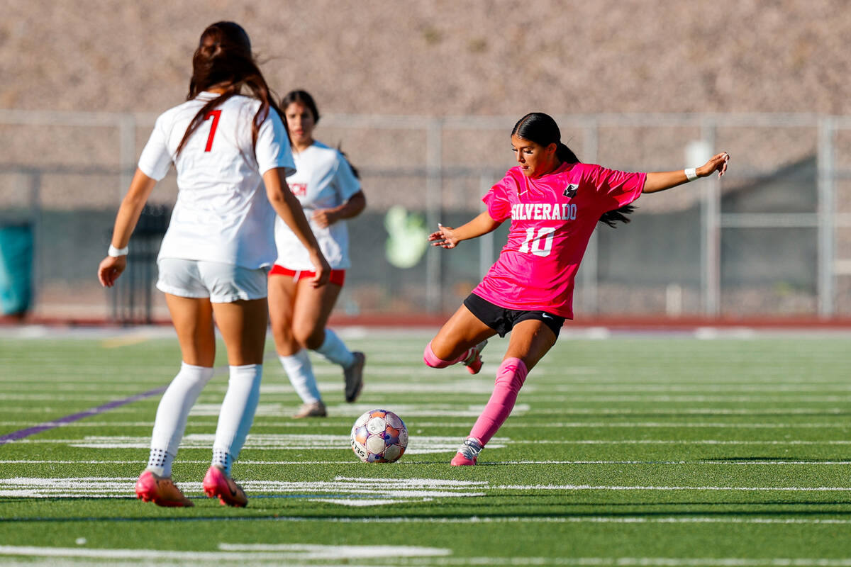 Silverado senior Makenze Oliver (10) looks to kick the ball down the field against SECTA during ...