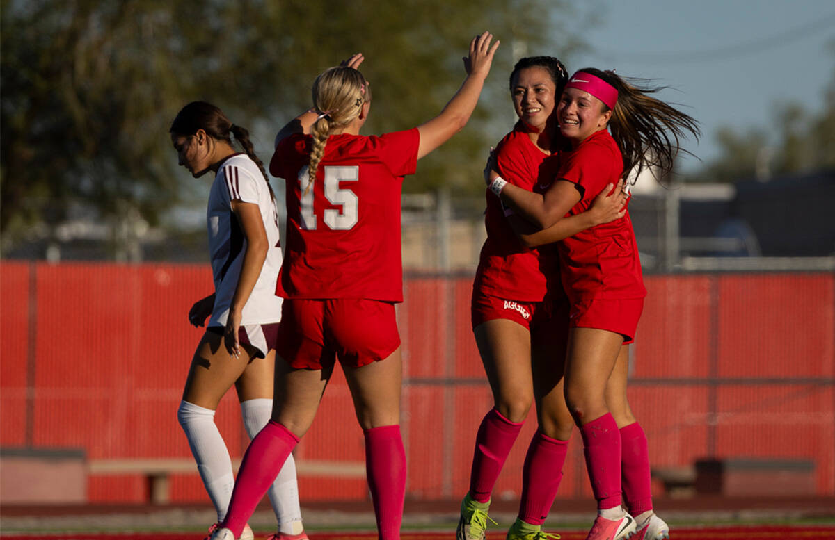 Arbor View's Danielle Morales, right, celebrates a goal with Sophia Sachs (4) and Elyse Bonnevi ...